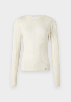 Maglione lungo a maniche ribbed di colore crema con scollatura a barchetta e piccolo logo sul fondo. Tessuto morbido e design aderente.