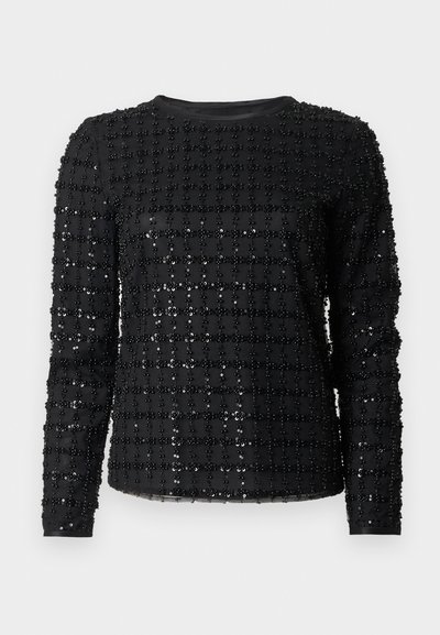 Μαύρο τοπ με μακριά μανίκια, διακοσμημένο με σχέδιο πλέγματος από μικρές, λαμπερές χάντρες σε λείο ύφασμα. Λαιμόκοψη σε σχήμα κύκλου και εφαρμοστή σιλουέτα.