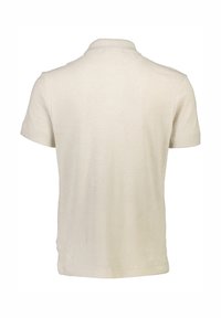 Beige kortärmad polo med texturerad väv, med en ribbad krage och rak nederkant, utformad utan synlig märkning eller accenter.