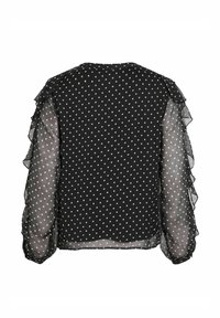 Blusa nera con pois bianchi, maniche a volant trasparenti, scollo rotondo e finitura texturizzata. I pois sono bianchi e distribuiti uniformemente.