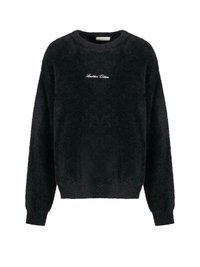 Suéter negro de felpa con cuello redondo, mangas largas y ajuste corto. Presenta texto bordado en blanco en el pecho. Textura suave.