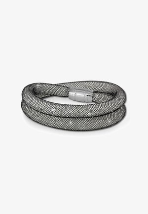 Hose tissé noir au design en mesh, avec un connecteur métallique argenté. La texture est lisse et d'apparence durable.