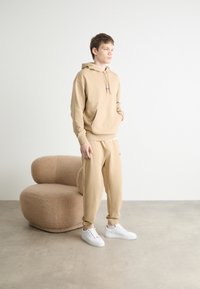 HUGO NALONSO - Sportska majica - medium beige