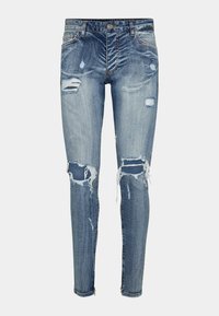 Jeans skinny en denim de couleur bleu moyen avec des déchirures usées et des bords effilochés. Dispose d'une fermeture à bouton et à fermeture éclair à l'avant.