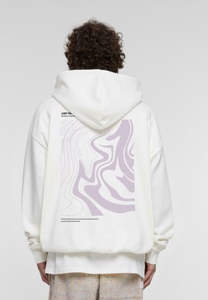 Felpa bianca con un grande design astratto viola sul retro, con testo nella parte superiore. Tessuto morbido con una vestibilità comoda e cappuccio.