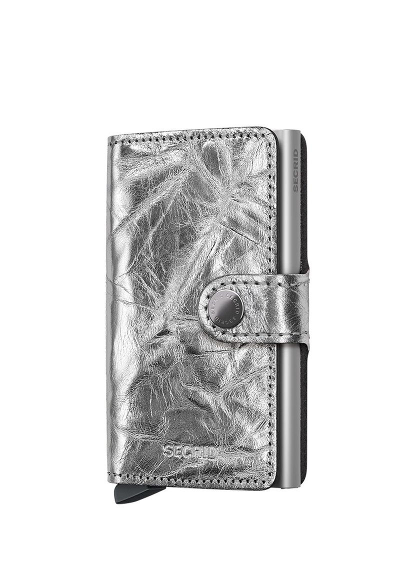 Silver metallic wallet featuring a textured leather exterior, snap closure, and a prominent brand logo. Compact and rectangular shape.