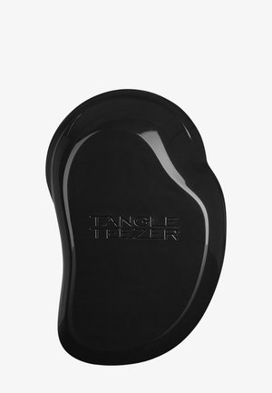 Zwarte plastic haarborstel met een ergonomisch, gevormd ontwerp. Voorzien van een reliëf "TANGLE TEEZER" logo, een gladde afwerking en een ovale vorm.
