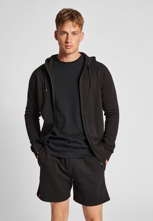 Men’s black hoodie with drawstrings, paired with a black t-shirt and matching shorts. The fabric appears soft and comfortable.