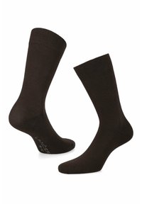 Brązowe bawełniane skarpetki z prążkowanymi mankietami, pełnej długości, gładka faktura oraz metka na dole z nazwą marki i rozmiarem.