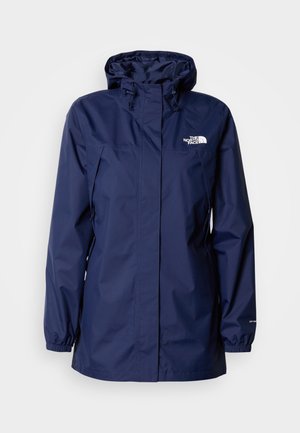 Marineblaue Kapuzen-Regenjacke mit Frontreißverschluss, elastischen Bündchen, seitlichen Taschen und weißem "The North Face"-Logo auf der Brust.