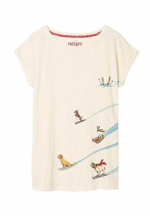 Cream-colored T-shirt with short sleeves featuring a playful graphic of skiing dogs and skiers in blue, with a soft, casual texture.