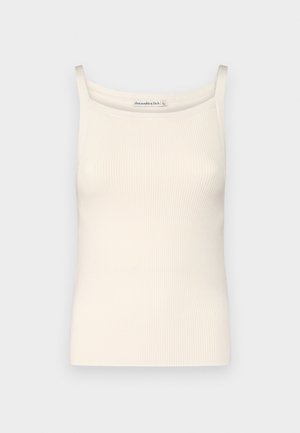 Cremfarbener, gerippter Tanktop mit dünnen Trägern und einem runden Ausschnitt, der eine glatte Textur und eine taillierte Form aufweist.