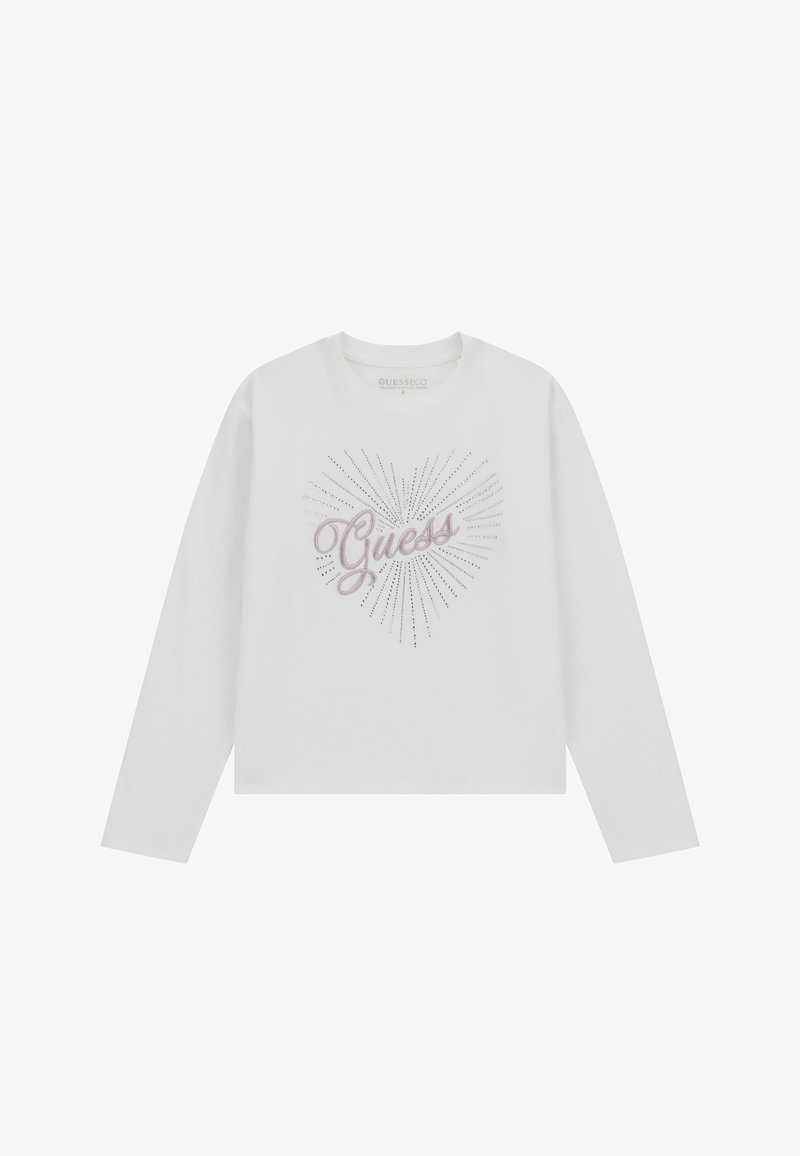 Biała koszulka z długim rękawem z nadrukiem serca i napisem „Guess” w różowym stylu pisma, ozdobiona srebrnymi kryształkami.