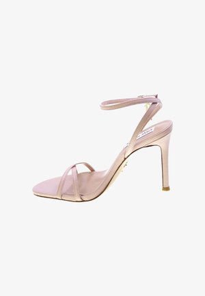 Sandalo nudo con tacco alto, sottili cinturini sopra le dita e intorno alla caviglia, con tacco a spillo e chiusura con fibbia dorata.