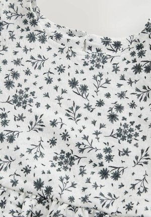 Valge kangas peene tumehalli lillemustriga. Sellel on ümar kaelus ja vöökohal voldid, mis tagavad lõdva istuvuse.