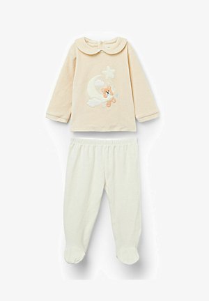 Beżowa bluzka z długim rękawem i okrągłym kołnierzem, z haftowanym misiem, księżycem i gwiazdami; zestawiona z kremowymi spodniami z detalem przy stopach.