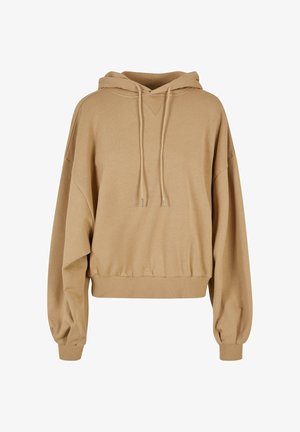 Sudadera beige de gran tamaño con capucha ajustable, mangas anchas y dobladillo acanalado. Tejido suave con una textura lisa y detalles mínimos.