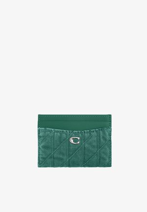 Porte-cartes matelassé vert avec un logo "C" argenté et plusieurs emplacements pour cartes sur fond blanc.