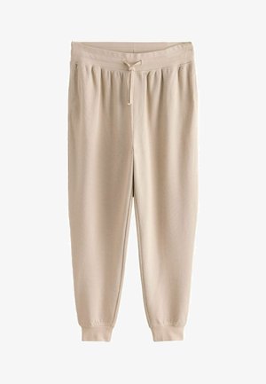 Beige fleece jogger pants with elastic waistband, drawstring, side pockets, and ribbed cuffs. Soft texture and relaxed fit.