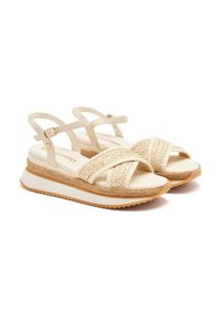 Sandales à plateforme tissées beige avec une bride de cheville ajustable, des accents en corde texturée et une semelle intermédiaire blanche. Semelle extérieure en caoutchouc pour une bonne adhérence.