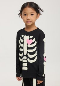 Terranova CON SCHELETRO CHE SI ILLUMINA AL BUIO SET Pigiama