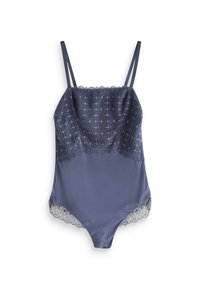 Tumehall lace-äärisega bodysuit, millel on kitsad rihmad, võrgusilma alumine osa ja keerukate mustritega pits ülemisel ees.