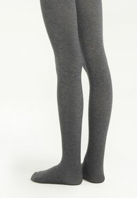 Szare rajstopy wykonane z gładkiego, elastycznego materiału. Posiadają bezszwowy krój, sięgający aż do kostki, z dopasowanym fasonem.