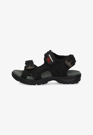 Black sandals with adjustable Velcro straps, textured fabric and mesh upper, cushioned gray insole, and rubber outsole with tread pattern.