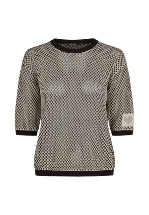 Black and white patterned knit sweater with short sleeves, black collar and cuffs, and a heart detail on the left sleeve.