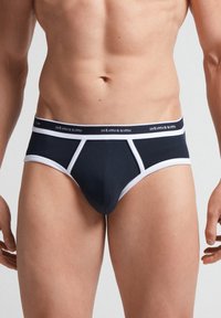 Marinblå herrkalsonger med en vit elastisk midjeband som har varumärkesnamnet. Designade för en åtsittande passform med kontrasterande vita accenter.