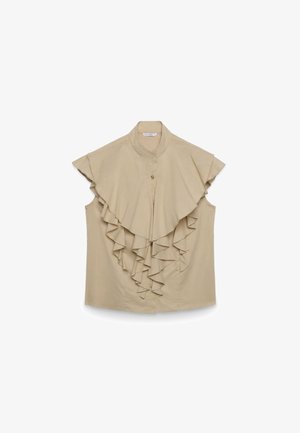 Beige ärmellose Bluse mit hohem Kragen und herabfließenden, geschichteten Rüschen auf der Vorderseite, mit einem einzelnen Knopfverschluss am Ausschnitt.