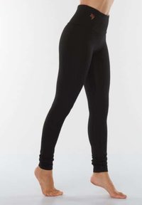 Mustat korkeavartiset legginsit, joissa on sileä pinta, vartalonmukainen muotoilu ja huomaamaton logo yksityiskohtana vyötäröllä.