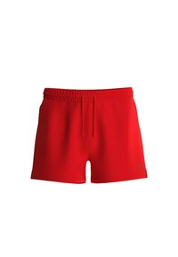 Pantaloni sportivi rossi con vita elastica intrecciata, cordino regolabile e una texture liscia e sinuosa. Branding minimale sul lato.