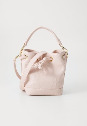 Pink bucket bag made of textured leather, featuring floral embossing, a drawstring closure, a removable shoulder strap, and gold hardware.