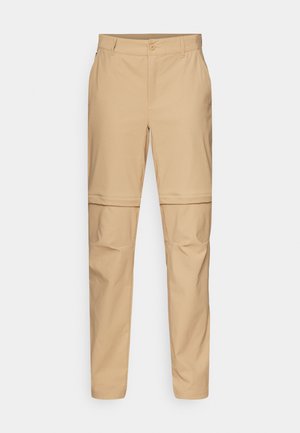 Pantalons cargo beiges à fermeture éclair amovible, avec un devant plat, une fermeture à bouton et des jambes fuselées. Fabriqués en tissu léger avec une texture lisse.