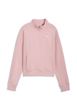 Maglia rosa chiaro a maniche lunghe con zip a un quarto, polsini a coste, colletto alto e logo Puma bianco sul petto a sinistra.