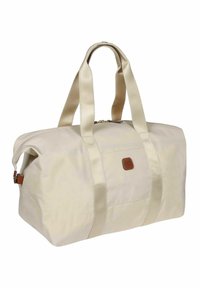 Borsa a viaggio beige con esterno in tessuto, manici in tessuto doppi e una patch in pelle con logo. Presenta una chiusura con zip e una forma morbida e strutturata.