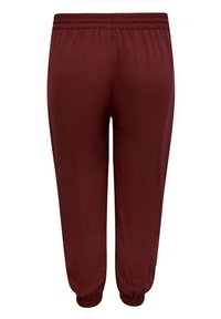 Burgundy joggerbyxor tillverkade av lättviktigt tyg. De har en elastisk midja och smalnande ärmar vid anklarna för en bekväm passform.