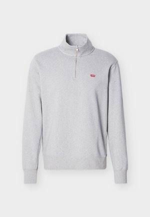 Sweat-shirt gris clair à fermeture éclair quart, col montant, manches longues, poignets et ourlet côtelés, avec un petit logo rouge Levi's sur la poitrine gauche.