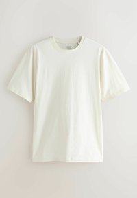 Balti medvilniniai marškinėliai trumpomis rankovėmis, apvaliu kaklu ir lygia tekstūra. Paprastas dizainas be raštų ar papildomų detalių.