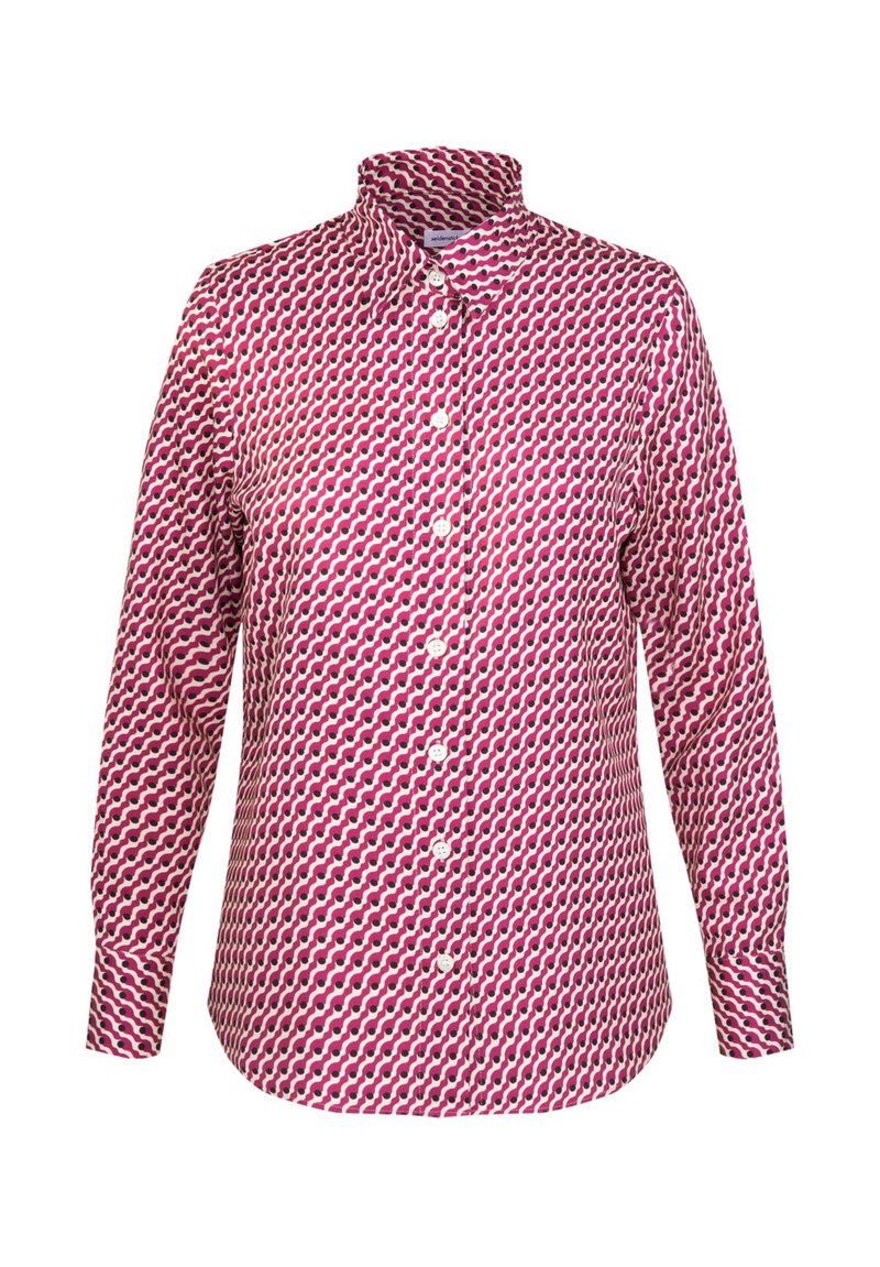 Skjorte med knaplukning i et pink og creme bølget mønster med opretstående krave. Har lange ærmer og en lige kant. Knapperne er hvide.