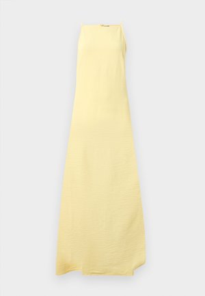 Gul spaghetti strap maxi kjole laget av lett, teksturert stoff med løs passform, med en rett halslinje og sidelommer.