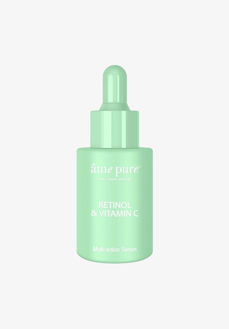 Grüne Glaspipettenflasche mit dem Etikett "Retinol & Vitamin C Multi-Action Serum" mit glänzender Oberfläche und runder Pipettenkappe.