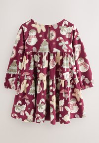 Klänning med lång ärm i vinröd bomull med en flerstegsdesign. Har färgglada festliga mönster som inkluderar träd, snögubbar och polkagrisar.