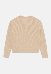 Beige kötött pulóver bordázott textúrával, hosszú ujjal és kerek nyakkal. A design cropped fazonnal és egyszerű kidolgozással rendelkezik.