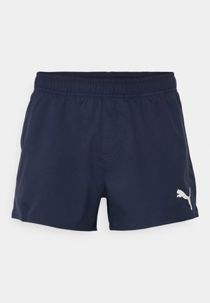 Marineblaue Shorts aus glattem Stoff mit einem elastischen Bund, auf der linken Seite mit einem kleinen weißen Puma-Logo.