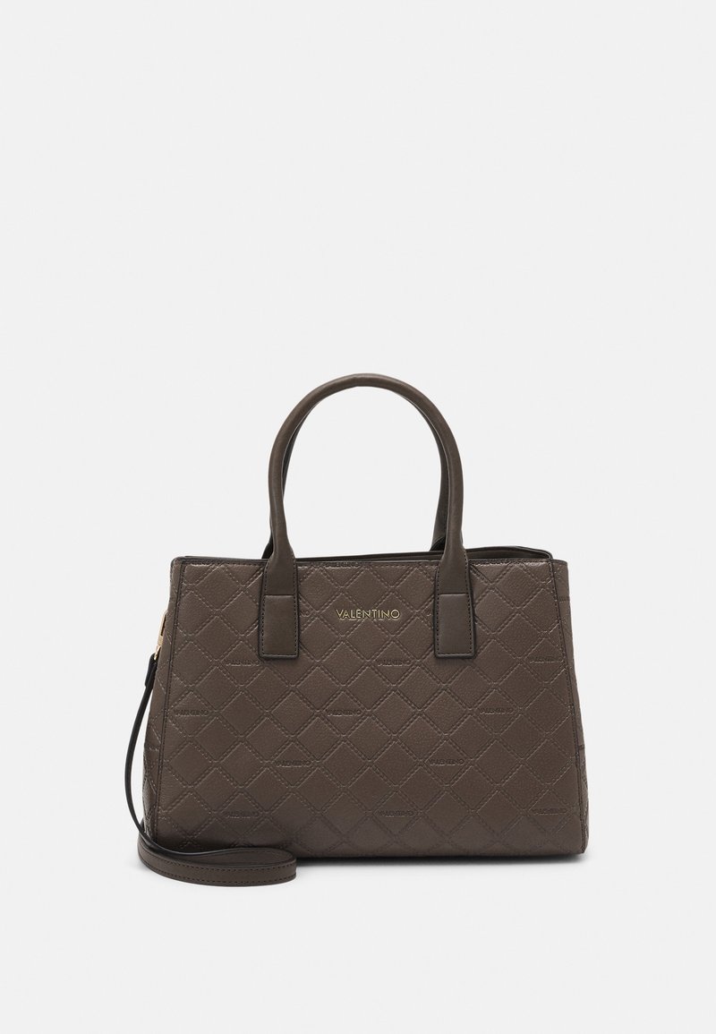 Brown quilted leather handbag with two top handles, a detachable shoulder strap, and gold logo detailing on the front.