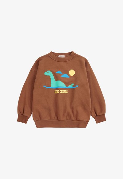 Sweat-shirt marron avec un dinosaure vert pixelisé, de l'eau bleue, un soleil jaune et des nuages avec le texte "BOBO CHOSES" sur le devant.