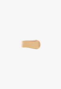 Beige foundation swatch with a smooth texture, featuring a creamy consistency and subtle sheen, extending in a tapered shape.