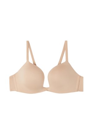 Beige padded bra with adjustable straps, smooth texture, and hook-and-eye closure at the back. No embellishments or patterns.